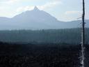 Crooked-topped Mt.Jefferson over fields of ancient, black lava flows.